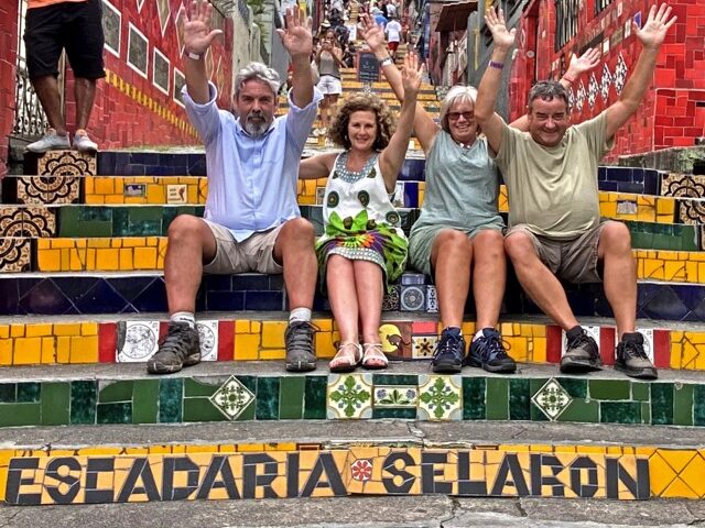 Travelers at the colorful Selarón Steps in Lapa, Rio de Janeiro