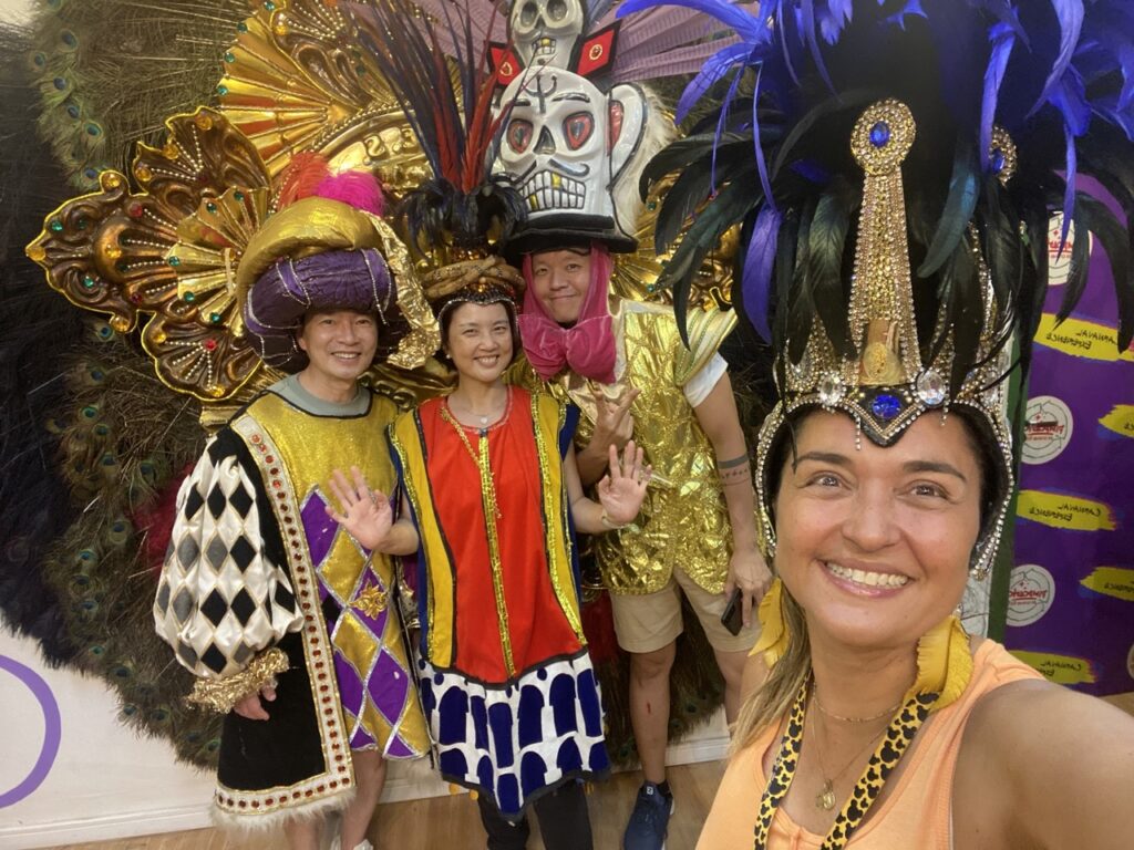 Travelers wearing Carnival costumes during a behind-the-scenes Carnival experience in Rio