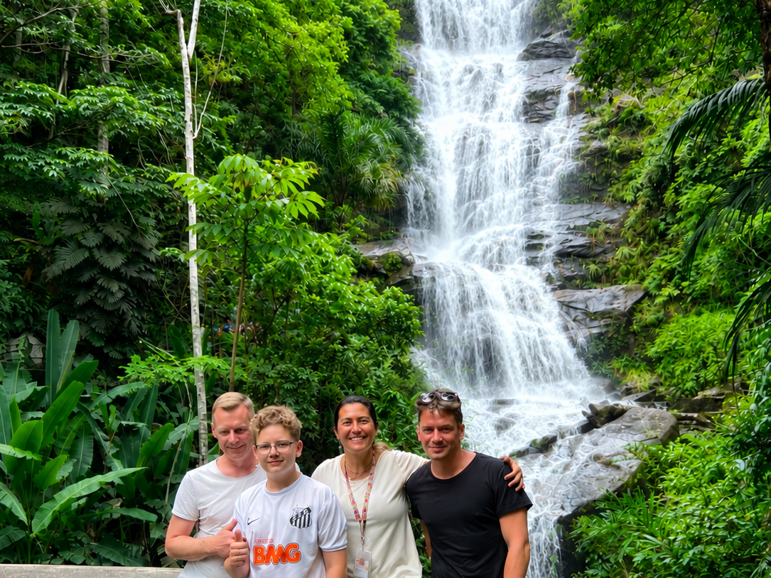 Travelers exploring a waterfall in Tijuca National Park during a private tour in Rio de Janeiro