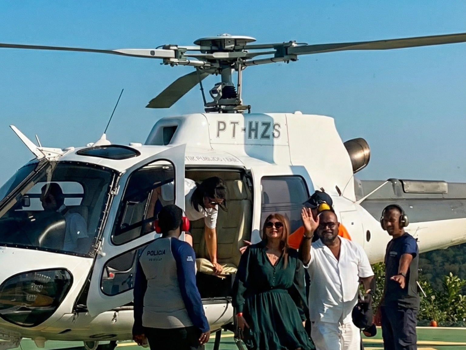 VIP travelers stepping out of a helicopter after a scenic flight over Rio de Janeiro